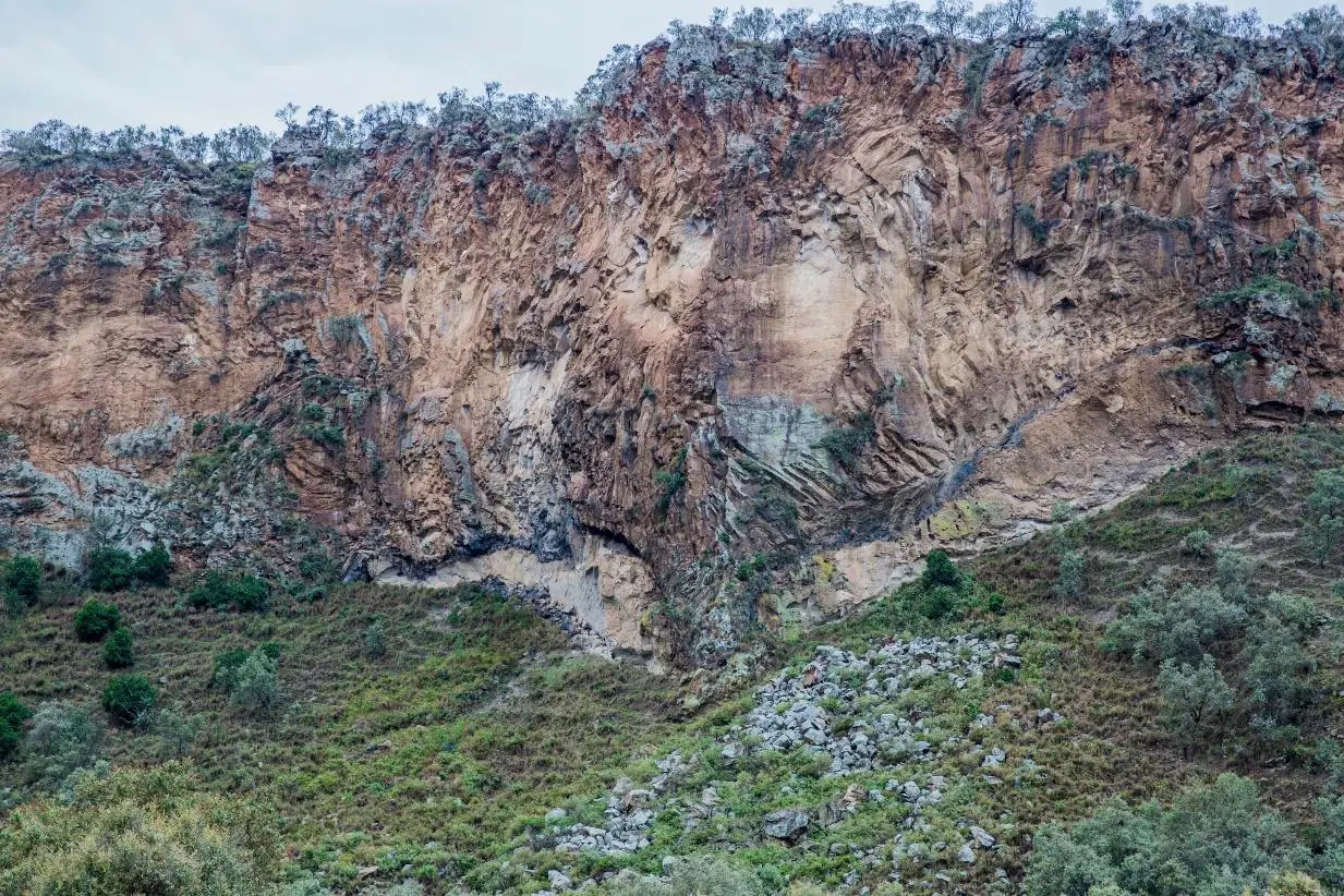 Rugged cliffs and lush vegetation in Hell’s Gate National Park, Kenya.