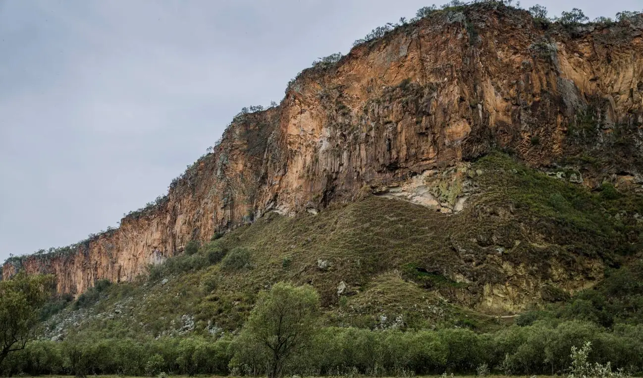 Majestic cliffs at Hell’s Gate National Park, Kenya, showcasing stunning rock formations.